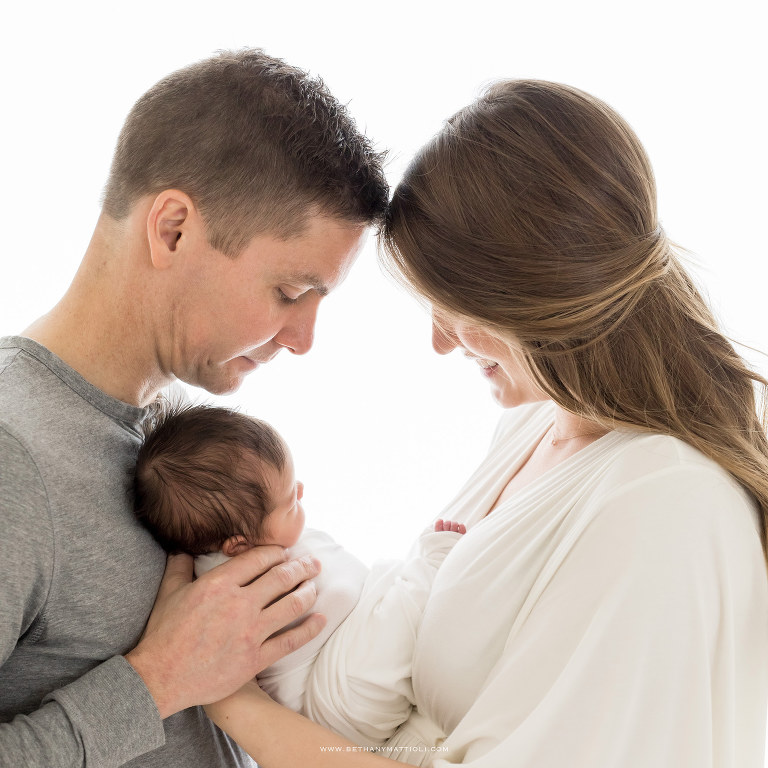 Parents and Newborn Backlit in front of Window | Morgan Hill Newborn Photography | Bethany Mattioli Photography 
