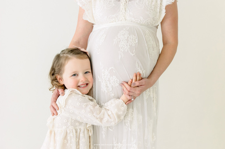 Smiling New Big Sister Maternity Photo